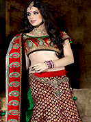 Symbol of fashion and beauty, each piece of our range of designer lehenga choli is certain to increase your look. This maroon and off white banarasi opara silk fish cut lehenga choli is beautifully designed with resham, sequins, zari, stone and patch work done in form of floral and paisley motiff. Matching maroon banarasi opara silk choli with border and contrasting off white net dupatta is enhancing the beauty of this lehenga. Lehenga waist can be customize upto 42 inches, length 40 inches and the bust size is upto 40 inches. As shown lehenga is available. Accessories shown in the image is just for photography purpose. Slight color variations are possible due to differing screen and photograph resolution.