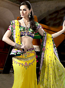 Make your collection more attractive and charming with this impressive dress. This Yellow and green net with satin lining fish cut lehenga choli is beautifully adorned with resham, sequins, zari, stone and patch work done in form of floral motiff. Contrasting banarasi opara silk deep green choli and maching net dupatta available with this. Beautiful embroidery in waist area is enhancing the beauty of this lehenga. Lehenga waist can be customize upto 42 inches, length 40 inches and the bust size is upto 40 inches. As shown lehenga is available. Accessories shown in the image is just for photography purpose. Slight color variations are possible due to differing screen and photograph resolution.