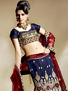 Embroidered lehengas are highly in order on a range of occasions such as wedding, formal party and festivals. This navy blue and maroon fish cut lehenga choli is nicely embroidered patch work. Embroidery is done with resham, zari and sequins work in form of floral and paisley motifs. The beautiful embroidery on lehenga made it awesome and gives you stylish and attractive look to others. Matching choli and contrast maroon dupatta is available with this lehenga. Accessories shown in the image is just for photography purpose. Slight Color variations are possible due to differing screen and photograph resolutions. 