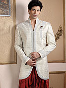 Today  fashion is really about sensuality which can be seen in this creation. Embellish yourself with the classy sherwani.  This sherwani made with pure Banarasi silk.  This sherwani embellished with stone, zardosi and stones  work. The beautiful heavy embroidery on collar made it awesome and gives you stylish and attractive look to others. Slight Color variations possible due to differing screen and photograph resolutions.