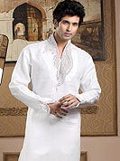 Emblem of fashion and style, each piece of our range of Designer Kurta is certain to enhance your look as per todays trends. This kurta made with linen fabric. This kurta embellished with cutdana, beads, pearls and stones. The beautiful heavy embroidery on collar, front and cuff made it awesome and gives you stylish and attractive look to others. This kurta paired with same color fabric pathani salwar that completes the look. Slight Color variations possible due to differing screen and photograph resolutions.