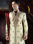 Its cool and have a very modern look to impress all. This sherwani made with brocade fabric. This sherwani embellished with stone, beads and  resham work. The beautiful heavy embroidery on collar, front, back and cuff made it awesome and gives you stylish and attractive look to others. The matching churidar is enhanced your personality. Slight Color variations possible due to differing screen and photograph resolutions.