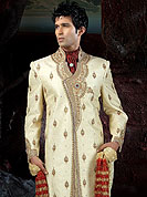 Its cool and have a very modern look to impress all. This sherwani made with brocade fabric. This sherwani embellished with stone, beads and  resham work. The beautiful heavy embroidery on collar, front, back and cuff made it awesome and gives you stylish and attractive look to others. The matching churidar is enhanced your personality. Slight Color variations possible due to differing screen and photograph resolutions.