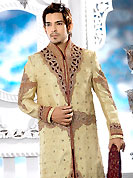 Today fashion is really about sensuality which can be seen in this creation. This beige sherwani embellished with all over cut work with velvet patch, resham, cutdana and stone work. The beautiful heavy embroidery on front border, collar, back and cuffs made it awesome and gives you stylish and attractive look to others. Contrasting churidar is enhanced your personality. This sherwani made with cotton silk fabric. Accessories shown in the image is just for photography purpose. Slight Color variations are possible due to differing screen and photograph resolutions.
