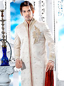 Make your collection more attractive with this dazzling dress. This off white sherwani embellished with all over cutdana, beads, zari, stone and patch work. The beautiful heavy embroidery on front border, collar, back and cuffs made it awesome and gives you stylish and attractive look to others. Contrasting churidar is enhanced your personality. This sherwani made with jacquard fabric. Accessories shown in the image is just for photography purpose. Slight Color variations are possible due to differing screen and photograph resolutions.