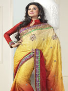 Be the rocker in the party by wearing this cool wear. This yellow and red saree is beautifully designed with extensive embroidered border and butti patch work. Embroidery is done with resham, zari and sequins work. This fabulous party wear saree is specially crafted for your stunning and gorgeous look. This beautiful drape is crafted with crepe fabric. Matching blouse come along with this saree. Slight color variations are possible due to differing screen and photograph resolution.
