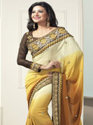 A desire that evokes a sense of belonging with a striking details. This pale yellow and mustard saree is beautifully designed with extensive embroidered border and butti patch work. Embroidery is done with resham, zari and sequins work. This fabulous party wear saree is specially crafted for your stunning and gorgeous look. This beautiful drape is crafted with faux georgette fabric. Matching blouse come along with this saree. Slight color variations are possible due to differing screen and photograph resolution.