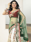 The fascinating beautiful subtly garment with lovely patterns. This green and white lehenga saree is beautifully designed with extensive embroidered border and butti patch work. Embroidery is done with resham, zari and sequins work. This fabulous party wear saree is specially crafted for your stunning and gorgeous look. This beautiful drape is crafted with net and georgette fabric. Matching blouse come along with this saree. Slight color variations are possible due to differing screen and photograph resolution.