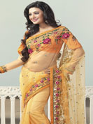 An occasion wear perfect is ready to rock you. This orange saree is beautifully designed with extensive embroidered border and butti patch work. Embroidery is done with resham, zari and sequins work. This fabulous party wear saree is specially crafted for your stunning and gorgeous look. This beautiful drape is crafted with net fabric. Matching blouse come along with this saree. Slight color variations are possible due to differing screen and photograph resolution.