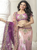 An endearing splash oh colors look gorgeous tridimensional charm. This mauve lehenga saree is beautifully designed with extensive embroidered border and butti patch work. Embroidery is done with resham, zari and sequins work. This fabulous party wear saree is specially crafted for your stunning and gorgeous look. This beautiful drape is crafted with net fabric. Matching blouse come along with this saree. Slight color variations are possible due to differing screen and photograph resolution.