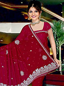 Emblem of fashion and beauty, each piece of our range of embroidered saree is certain to enhance your look as per today’s trends. This beautiful saree have beautiful designed with stone, cutdana, nag, zarken work in form of floral motifs. This saree material is chiffon. Get an attractive look with this casual wear saree. Matching Blouse is available with this saree. Slight Color variations are possible due to differing screen and photograph resolutions.