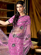 Take the fashion industry by storm in this beautiful embroidered saree. A simply beautiful saree adorns nice floral embroidery work done with cutdana work. This saree gives you a cultural look and growing your attractiveness. This drape material is net. This saree is also available in Light blue, fawn, purple and peach colors. Matching blouse is available. Slight color variations are possible due to differing screen and photograph resolution.