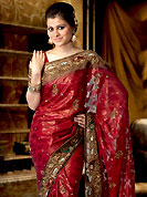 Welcome to the new era of Indian fashion wear. This saree blown up cutdana and velvet worked embroidered border and floral butti on all over saree make different to others. Saree gives you a singular and dissimilar look. This drape material is georgette. Matching blouse is available. This saree is also available in turquoise, pink, red and purple colors. Slight color variations are possible due to differing screen and photograph resolution.