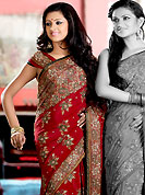 Breathtaking collection of sarees with stylish embroidery work and fabulous style. This maroon crepe saree is nicely designed with embroidered and silk patch work in fabulous style. Embroidery is done with resham, zari, sequins, stone and cutdana work in form of floral motifs. Beautiful embroidery work on saree make attractive to impress all. This saree gives you a modern and different look in fabulous style. Matching blouse is available with this saree. Slight color variations are possible due to differing screen and photograph resolution.