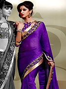 Get ready to sizzle all around you by sparkling saree. This purple crepe saree is nicely designed with resham and patch in form of floral motifs. Beautiful patch border on saree make attractive to impress all. This saree gives you a modern and different look in fabulous style. Matching blouse is available with this saree. Slight color variations are possible due to differing screen and photograph resolution.