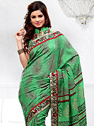 Let your personality articulate for you with this amazing embroidered saree. This green bhagalpuri silk saree is nicely designed with embroidered patch work is done with resham and zari work. Saree gives you a singular and dissimilar look. Matching blouse is available. Slight color variations are possible due to differing screen and photograph resolution.