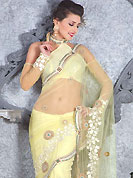 Take the fashion industry by storm in this beautiful embroidered saree. This light yellow net saree have beautiful embroidery patch work which is embellished with resham work. Fabulous designed embroidery gives you an ethnic look and increasing your beauty. Matching blouse is available. Slight Color variations are possible due to differing screen and photograph resolutions.