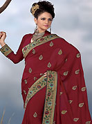 The traditional patterns used on this saree maintain the ethnic look. This red faux georgette saree have beautiful embroidery patch work which is embellished with resham, zari and stone work in floral motifs. Fabulous designed embroidery gives you an ethnic look and increasing your beauty. Matching blouse is available. Slight Color variations are possible due to differing screen and photograph resolutions.
