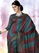 The evolution of style species collection spells pure femininity. This dark grey, blue and red art silk saree is nicely designed with floral and paisley print work in fabulous style. This beautiful saree is used for casual porpose which gives you a singular and dissimilar look. Color blend of this saree is nice. Matching blouse is available with this saree. Slight Color variations are possible due to differing screen and photograph resolutions.