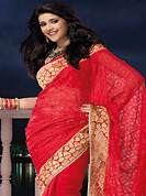 Let your personality articulate for you with this amazing embroidered saree. This red chiffon saree is nicely designed with embroidered and patch border work is done with zari and stone work. Saree gives you a singular and dissimilar look. Matching blouse is available. Slight color variations are possible due to differing screen and photograph resolution.