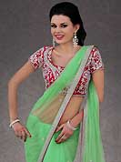 Let your personality articulate for you with this amazing embroidered saree. This light green net saree is nicely designed with embroidery patch work is done with stone and cutbeads work. Beautiful embroidery work on saree make attractive to impress all. This saree gives you a modern and different look in fabulous style. Contrasting dark pink blouse is available. Slight color variations are possible due to differing screen and photograph resolution.