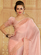 Let your personality articulate for you with this amazing embroidered saree. This peach chiffon jacquard saree is nicely designed with embroidery patch work is done with resham, stone and lace work. Saree gives you a singular and dissimilar look. Matching blouse is available. Slight color variations are possible due to differing screen and photograph resolution.
