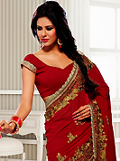 Get ready to sizzle all around you by sparkling saree. This maroon georgette saree have beautiful embroidery patch work which is embellished with resham, zari and stone work. Fabulous designed embroidery gives you an ethnic look and increasing your beauty. Matching blouse is available. Slight Color variations are possible due to differing screen and photograph resolutions.