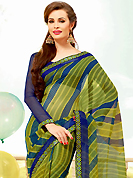 The traditional patterns used on this saree maintain the ethnic look. This beautiful olive green and dark blue super net saree is nicely designed with stripe, dots, polka dots print and graceful patch border. Beautiful print work on saree make attractive to impress all. It will enhance your personality and gives you a singular look. Matching blouse is available with this saree. Slight color variations are due to differing screen and photography resolution.