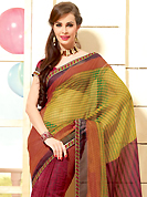 The most radiant carnival of style and beauty. This beautiful maroon and mustard super net saree is nicely designed with geometric print and graceful patch border. Beautiful print work on saree make attractive to impress all. It will enhance your personality and gives you a singular look. Matching blouse is available with this saree. Slight color variations are due to differing screen and photography resolution.
