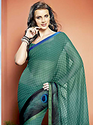 The traditional patterns used on this saree maintain the ethnic look. This beautiful turquoise green and black faux georgette saree is nicely designed with abstract, peacock feather like print and graceful patch border. Beautiful print work on saree make attractive to impress all. It will enhance your personality and gives you a singular look. Matching blouse is available with this saree. Slight color variations are due to differing screen and photography resolution.