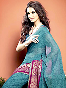 It is color this season and bright shaded suits are really something that is totally in vogue. This beautiful teal blue faux georgette saree is nicely designed with abstract, gold print and graceful patch border. Beautiful print work on saree make attractive to impress all. It will enhance your personality and gives you a singular look. Matching blouse is available with this saree. Slight color variations are due to differing screen and photography resolution.