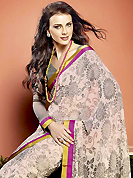 Dreamy variation on shape and forms compliment your style with tradition. This beautiful off white faux georgette saree is nicely designed with floral print and graceful patch border. Beautiful print work on saree make attractive to impress all. It will enhance your personality and gives you a singular look. Contrasting grey blouse is available with this saree. Slight color variations are due to differing screen and photography resolution.