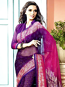 An occasion wear perfect is ready to rock you. This beautiful shaded purple and pink faux georgette saree is nicely designed with bandhej, floral print and graceful patch border. Beautiful print work on saree make attractive to impress all. It will enhance your personality and gives you a singular look. Matching blouse is available with this saree. Slight color variations are due to differing screen and photography resolution.