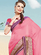 Make a trendy look with this classic embroidered saree. This maroon and green net and art silk saree is nicely designed with embroidered patch work is done with resham and zari work. Beautiful embroidery work on saree make attractive to impress all. This saree gives you a modern and different look in fabulous style. Matching green blouse is available. Slight color variations are possible due to differing screen and photograph resolution.