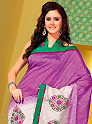 It is color this season and bright shaded suits are really something that is totally in vogue. This shaded light purple and off white art silk saree is nicely designed with floral, abstract print and patch bordered work. Beautiful embroidery work on saree make attractive to impress all. This saree gives you a modern and different look in fabulous style. Contrasting green blouse is available. Slight color variations are possible due to differing screen and photograph resolution.