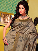 Take the fashion industry by storm in this beautiful embroidered saree. This dusty fawn art silk saree is nicely designed with abstract, stripe print, self weaving zari and patch bordered work. Beautiful embroidery work on saree make attractive to impress all. This saree gives you a modern and different look in fabulous style. Matching blouse is available. Slight color variations are possible due to differing screen and photograph resolution.