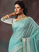 A desire that evokes a sense of belonging with a striking details. This beautiful sky blue and off white cotton saree is nicely designed with abstract print and self weaving zari work. Beautiful print work on saree make attractive to impress all. It will enhance your personality and gives you a singular look. Matching blouse is available with this saree. Slight color variations are due to differing screen and photography resolution.