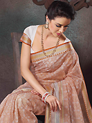 Envelope yourself in classic look with this charming saree. This beautiful off white and rust cotton saree is nicely designed with abstract print and self weaving zari work. Beautiful print work on saree make attractive to impress all. It will enhance your personality and gives you a singular look. Matching blouse is available with this saree. Slight color variations are due to differing screen and photography resolution.