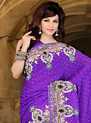 Try out this year top trend, glowing, bold and natural collection. This purple faux chiffon saree have beautiful embroidery patch work which is embellished with zari, sequins, stone and zardosi work. Fabulous designed embroidery gives you an ethnic look and increasing your beauty. Matching blouse is available. Slight Color variations are possible due to differing screen and photograph resolutions.