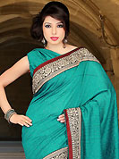 The evolution of style species collection spells pure femininity. This turquoise green art silk saree have beautiful embroidery patch work which is embellished with zari, sequins and stone work. Fabulous designed embroidery gives you an ethnic look and increasing your beauty. Matching blouse is available. Slight Color variations are possible due to differing screen and photograph resolutions.
