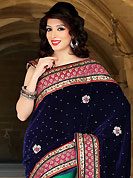Keep the interest with this designer embroidery saree. This navy blue and green velvet and net saree have beautiful embroidery patch work which is embellished with resham, stone and cutbeads work. Fabulous designed embroidery gives you an ethnic look and increasing your beauty. Matching blouse is available. Slight Color variations are possible due to differing screen and photograph resolutions.
