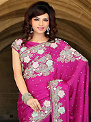 Make a trendy look with this classic embroidered saree. This dark pink satin chiffon saree have beautiful embroidery patch work which is embellished with resham, zari, stone, cutdana and cutbeads work. Fabulous designed embroidery gives you an ethnic look and increasing your beauty. Matching blouse is available. Slight Color variations are possible due to differing screen and photograph resolutions.