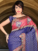 This season dazzle and shine in pure colors. This dark blue and salmon viscose and art silk saree have beautiful embroidery patch work which is embellished with resham, sequins and stone work. Fabulous designed embroidery gives you an ethnic look and increasing your beauty. Matching blouse is available. Slight Color variations are possible due to differing screen and photograph resolutions.
