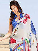 Envelope yourself in classic look with this charming saree. This beautiful off white faux georgette saree is nicely designed with floral print work. Beautiful print work on saree make attractive to impress all. It will enhance your personality and gives you a singular look. Contrasting blue blouse is available with this saree. Slight color variations are due to differing screen and photography resolution.