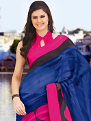 Exquisite combination of color, fabric can be seen here. This beautiful dark blue, dark pink and black brasso faux georgette saree is nicely designed with geometric print work. Beautiful print work on saree make attractive to impress all. It will enhance your personality and gives you a singular look. Matching blouse is available with this saree. Slight color variations are due to differing screen and photography resolution.