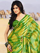 Printed sarees are the best choice for a girl to enhance her feminine look. This beautiful green and yellow brasso faux georgette saree is nicely designed with abstract and stripe print work. Beautiful print work on saree make attractive to impress all. It will enhance your personality and gives you a singular look. Matching blouse is available with this saree. Slight color variations are due to differing screen and photography resolution.