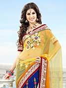Make a trendy look with this classic embroidered saree. This yellow and royal blue net saree have beautiful embroidery patch work which is embellished with resham, silver zardosi, stone and beads work. Fabulous designed embroidery gives you an ethnic look and increasing your beauty. Contrasting red blouse is available. Slight Color variations are possible due to differing screen and photograph resolutions.