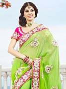 Try out this year top trend, glowing, bold and natural collection. This light green viscose georgette saree have beautiful embroidery patch work which is embellished with resham, stone and beads work. Fabulous designed embroidery gives you an ethnic look and increasing your beauty. Contrasting pink blouse is available. Slight Color variations are possible due to differing screen and photograph resolutions.