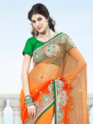 The traditional patterns used on this saree maintain the ethnic look. This shaded orange net saree have beautiful embroidery patch work which is embellished with resham, zardosi, stone and beads work. Fabulous designed embroidery gives you an ethnic look and increasing your beauty. Contrasting green blouse is available. Slight Color variations are possible due to differing screen and photograph resolutions.