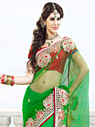 Envelope yourself in classic look with this charming saree. This green net saree have beautiful embroidery patch work which is embellished with resham, stone and beads work. Fabulous designed embroidery gives you an ethnic look and increasing your beauty. Contrasting dark red blouse is available. Slight Color variations are possible due to differing screen and photograph resolutions.